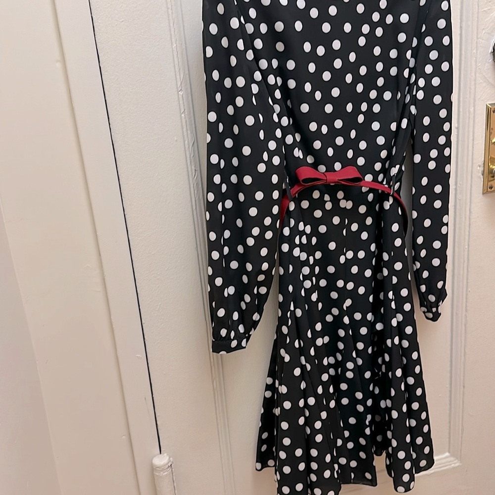 Size 40 (eur) crepe flair dress with ruffle at lower half.